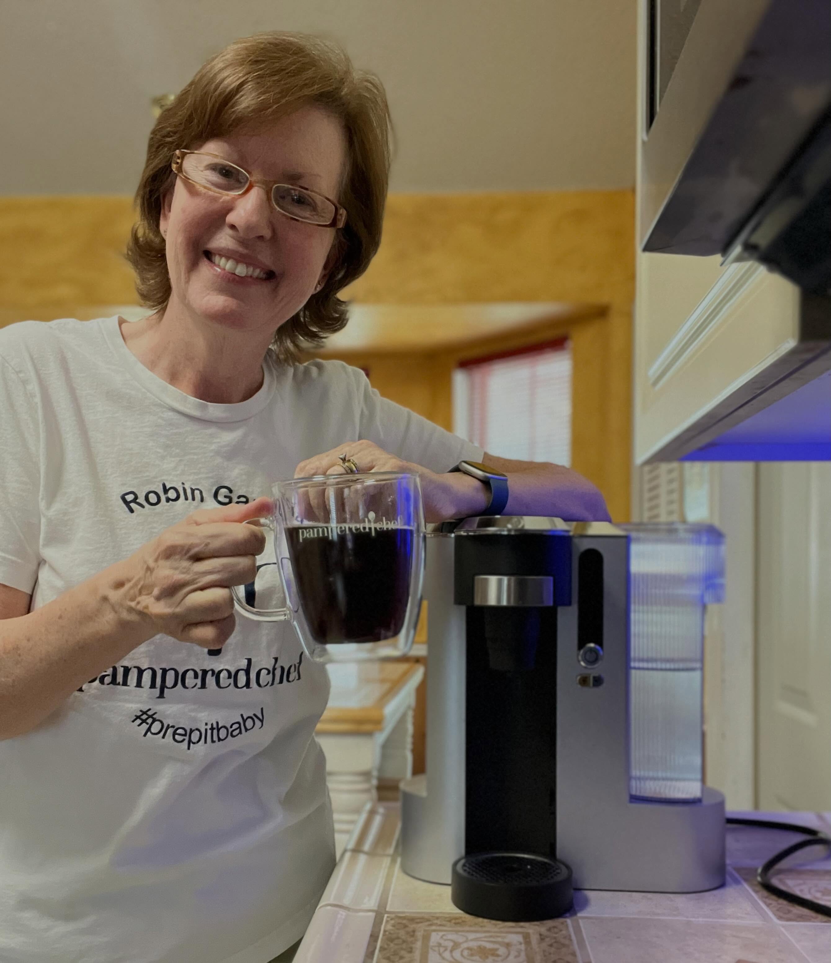 ☕ People often ask me what my favorite Pampered Chef product is.

Right now? Hands down, my Deluxe Coffee Maker!

If you know me, you know I LOVE coffee. And it doesn't matter if it's 105 degrees outside and hotter than Hades here in Texas... I'm still reaching for my coffee mug. 😂

This machine has officially turned me into my own Starbucks. Fancy coffees, iced coffees, hot coffees... whenever the craving strikes, I'm covered. And let's be honest, making my favorite drinks at home is a lot friendlier on the wallet, too!

So now I have to know...

☕ Are you team hot coffee year-round?
🧊 Or do you switch to iced coffee when summer arrives?

Tell me your coffee order below! 👇🤎
